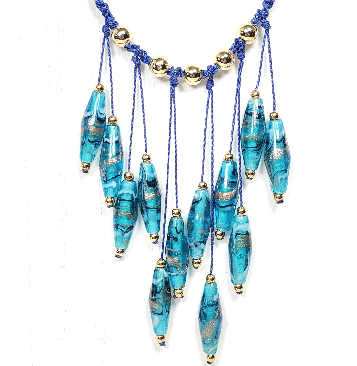 Teal Lampwork Glass Necklace – Handmade Boho Jewelry with Rhombus Beads, Golden Accents & Adjustable Blue Cotton Cord