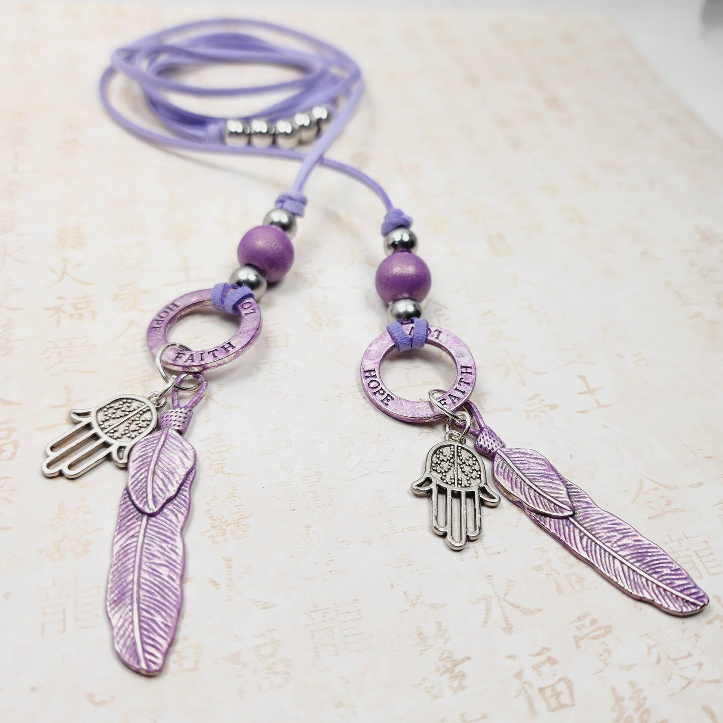 Boho Hamsa Feather Necklace – Handmade Jewelry with Silver Hamsa Charm, Purple Feather, Wood Bead & Faux Suede Cord