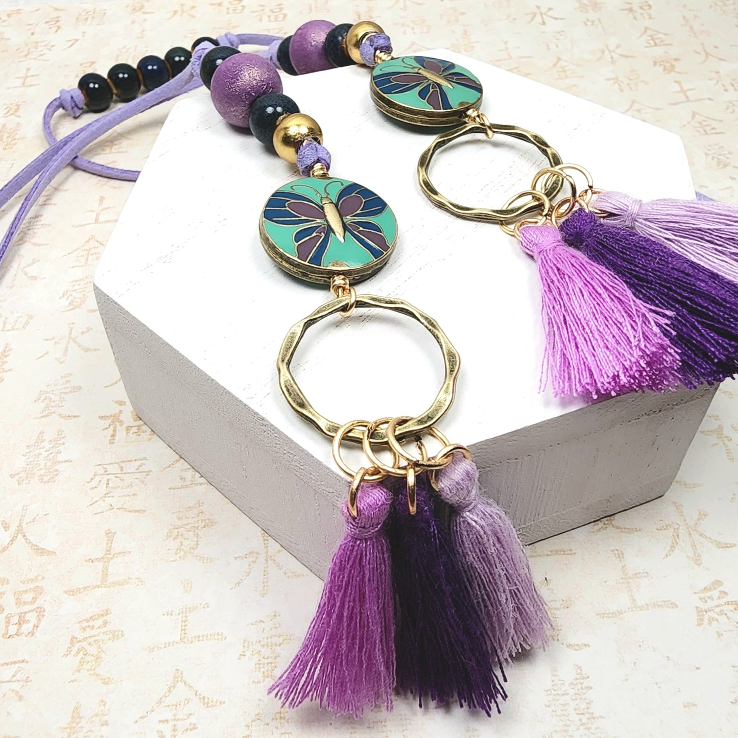 Boho Butterfly Necklace – Handmade Jewelry with Brass Coin Beads, Purple Wood, Blue Ceramic & Tassels on Long Faux Suede Cord