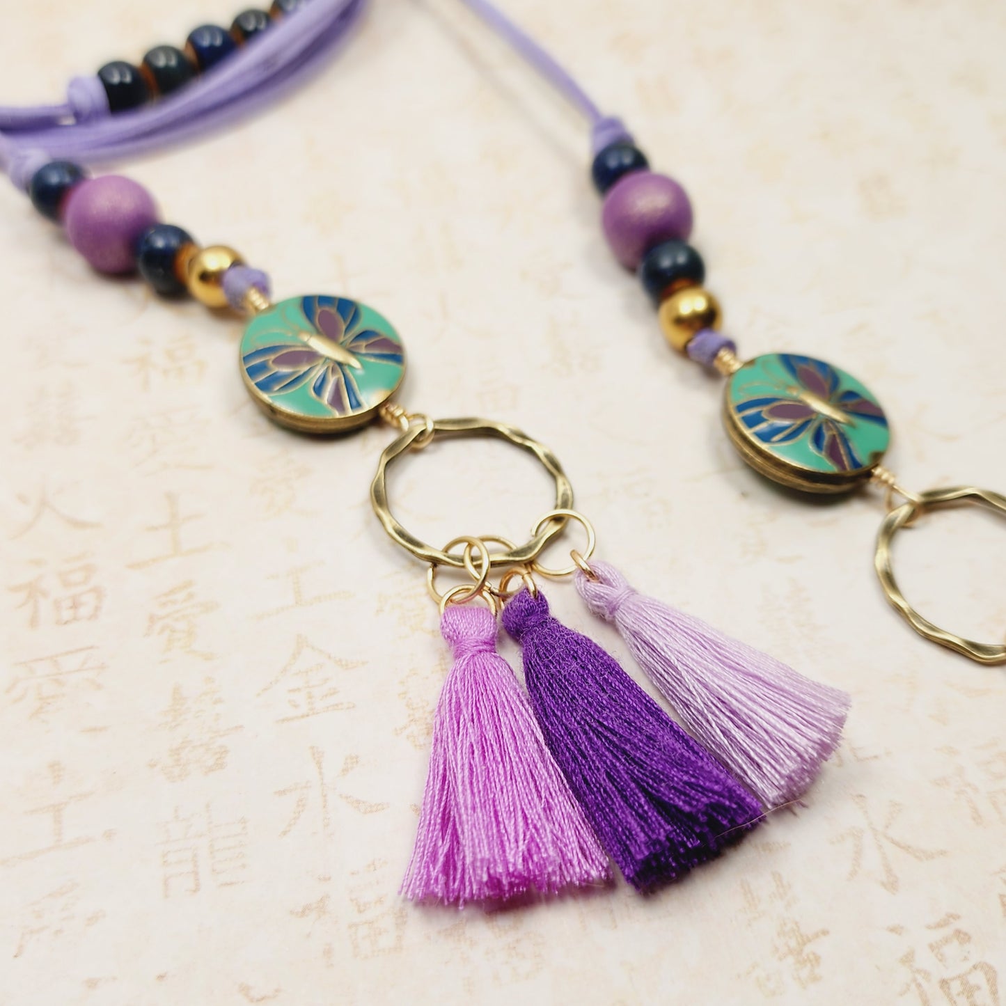 Boho Butterfly Necklace – Handmade Jewelry with Brass Coin Beads, Purple Wood, Blue Ceramic & Tassels on Long Faux Suede Cord