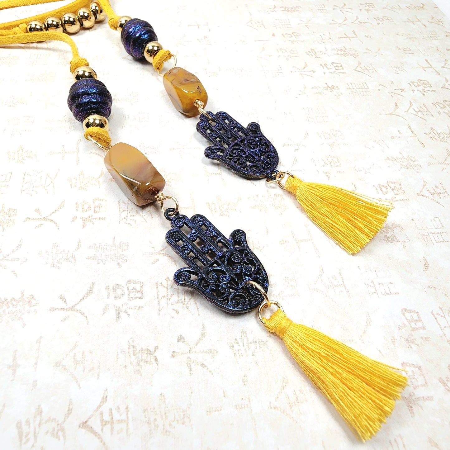 Boho Hamsa Hand Necklace – Handmade Jewelry with Blue Hamsa Charm, Yellow Jasper, Golden Beads & Tassel on Faux Suede Brown Cord