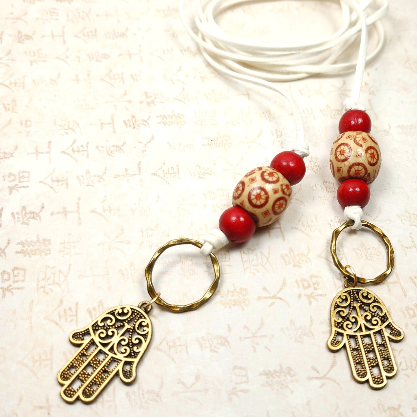 Boho Hamsa Hand Necklace – Handmade Jewelry with Brass Hamsa Charm, Red & Beige Wood Beads, Brass Rings & White Faux Suede Cord