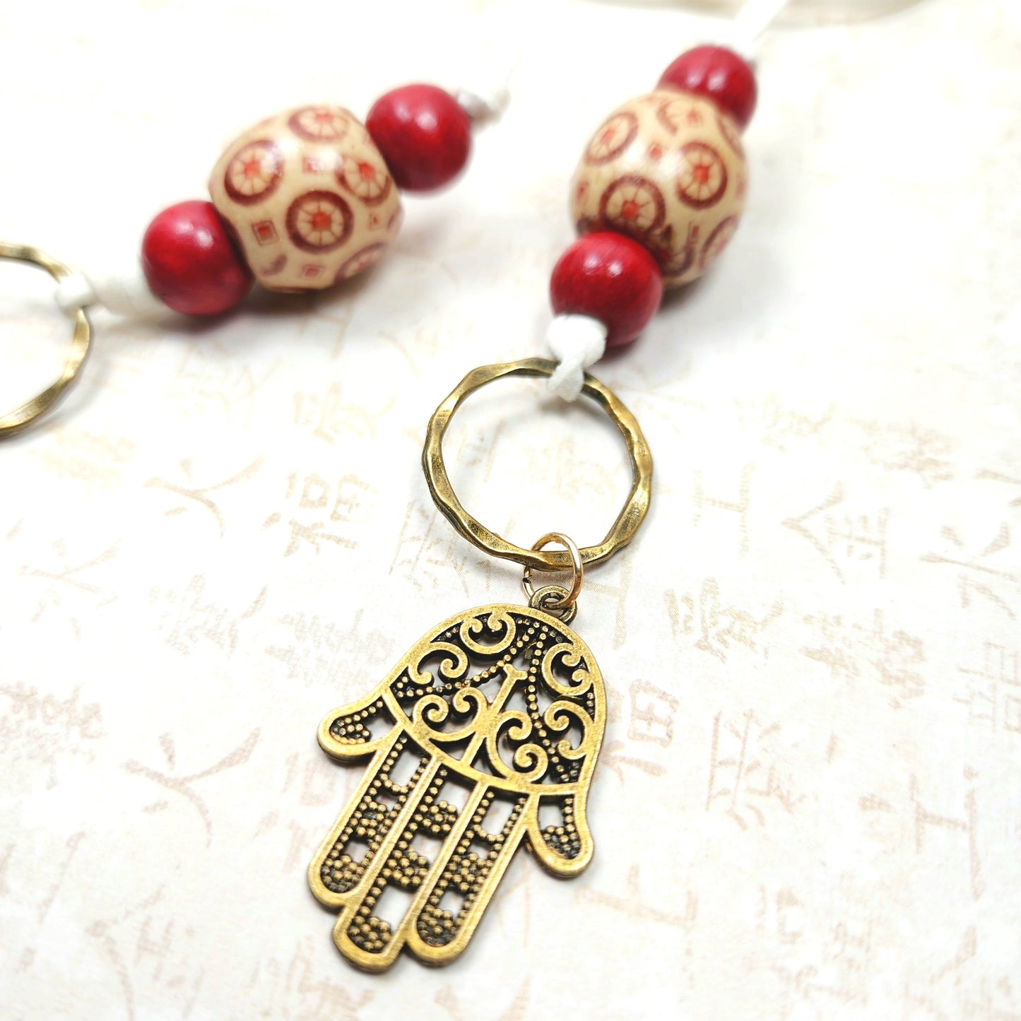 Boho Hamsa Hand Necklace – Handmade Jewelry with Brass Hamsa Charm, Red & Beige Wood Beads, Brass Rings & White Faux Suede Cord