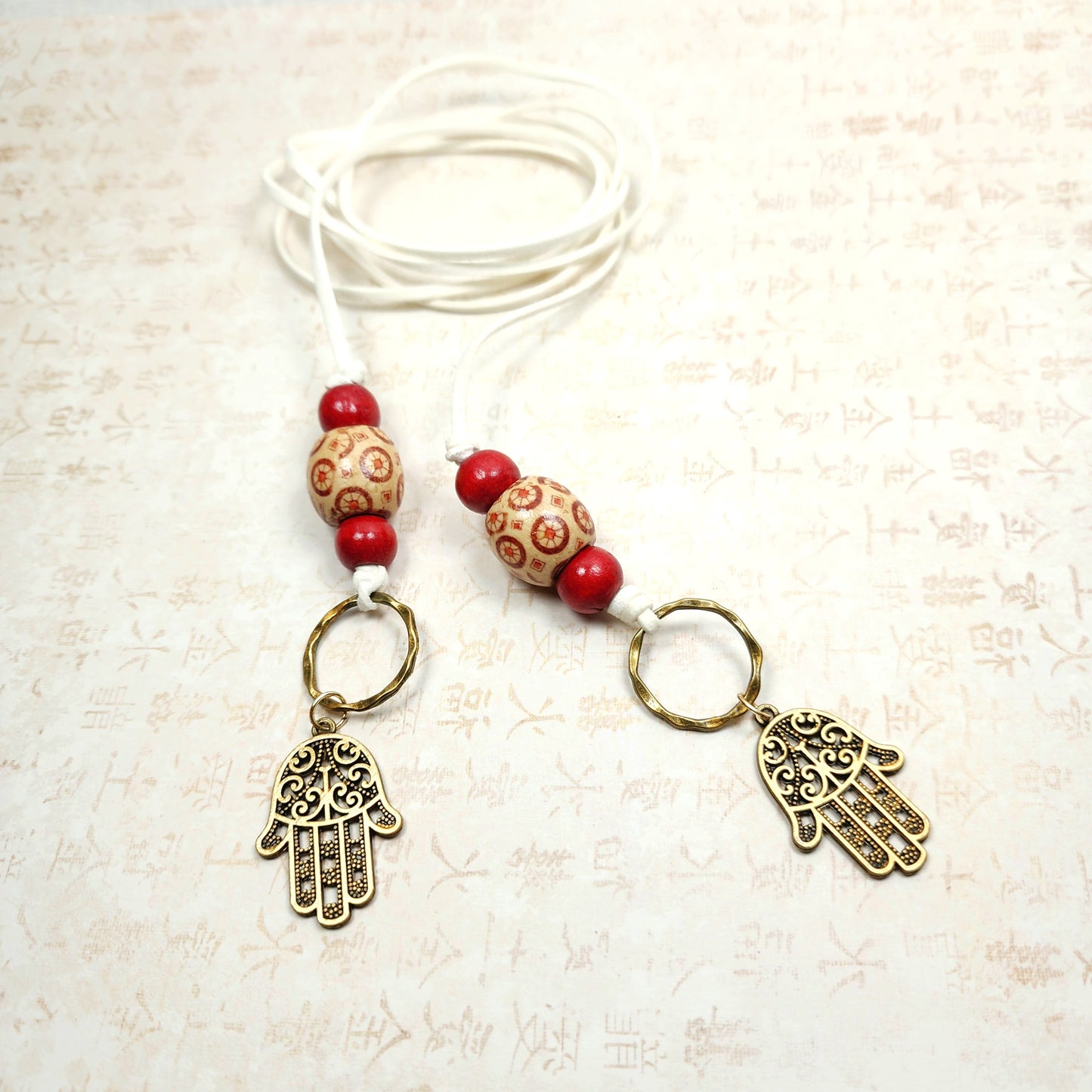 Boho Hamsa Hand Necklace – Handmade Jewelry with Brass Hamsa Charm, Red & Beige Wood Beads, Brass Rings & White Faux Suede Cord