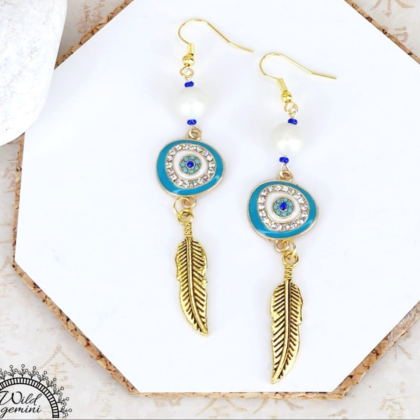 Boho Evil Eye Feather Earrings – Handmade Gold Dangles with White Glass Beads, Rhinestone Charms & Gold Feathers, 3” Long