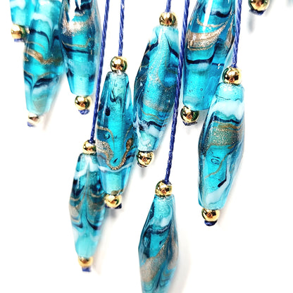 Teal Lampwork Glass Necklace – Handmade Boho Jewelry with Rhombus Beads, Golden Accents & Adjustable Blue Cotton Cord