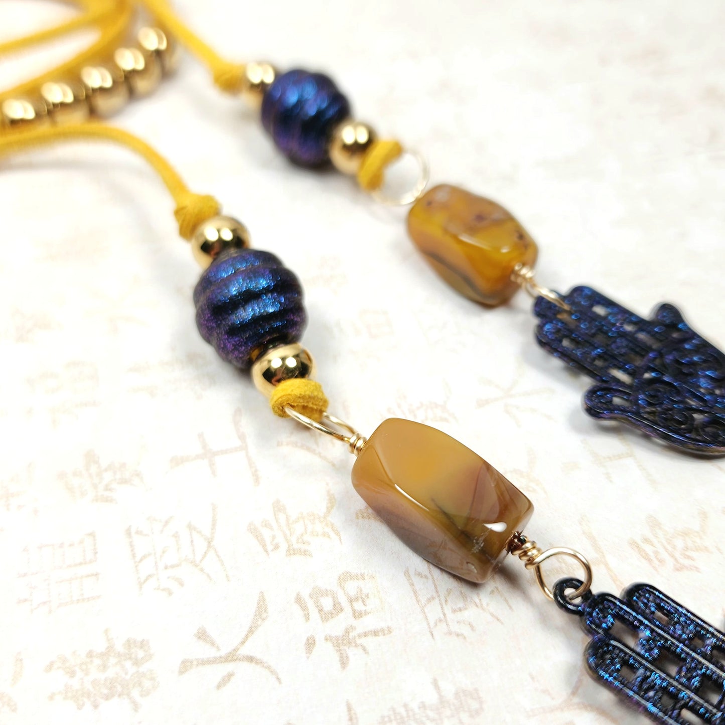 Boho Hamsa Hand Necklace – Handmade Jewelry with Blue Hamsa Charm, Yellow Jasper, Golden Beads & Tassel on Faux Suede Brown Cord