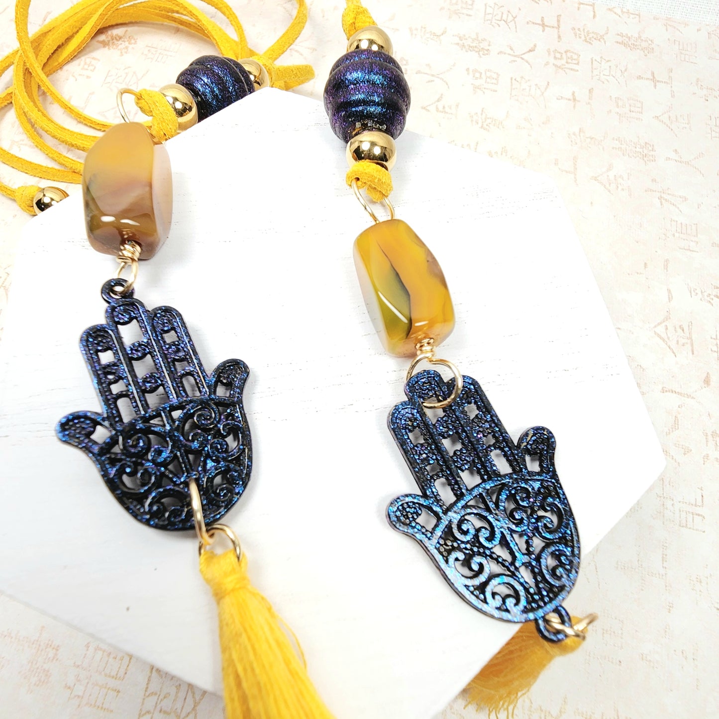 Boho Hamsa Hand Necklace – Handmade Jewelry with Blue Hamsa Charm, Yellow Jasper, Golden Beads & Tassel on Faux Suede Brown Cord