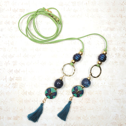 Boho Butterfly Necklace – Handmade Jewelry with Brass Coin Beads, Blue Ceramic, Teal Tassel & Green Faux Suede Cord