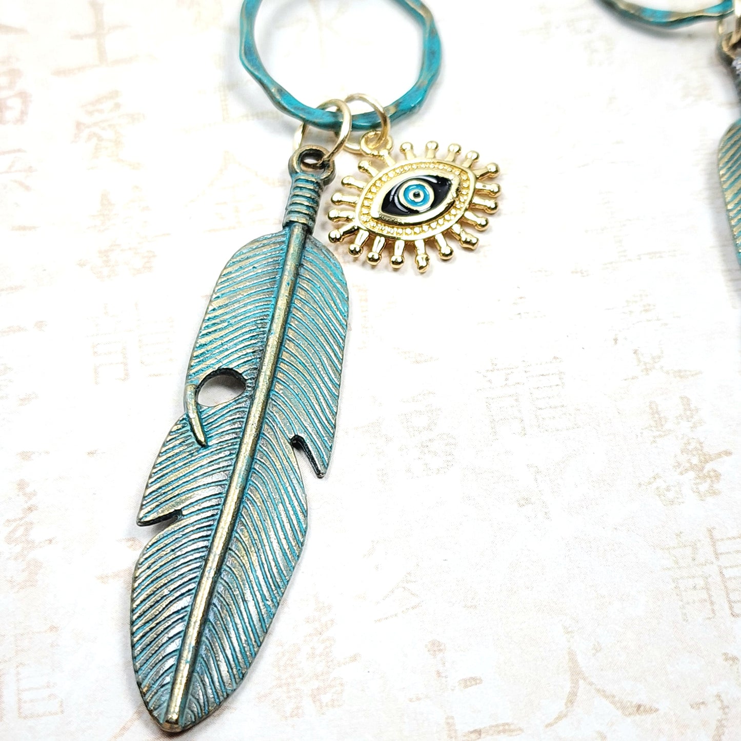 Boho Evil Eye Feather Necklace – Handmade Jewelry with Brass Feathers, Teal Wood Beads, Golden Accents & Faux Suede Cord