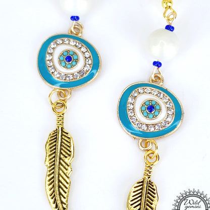 Boho Evil Eye Feather Earrings – Handmade Gold Dangles with White Glass Beads, Rhinestone Charms & Gold Feathers, 3” Long