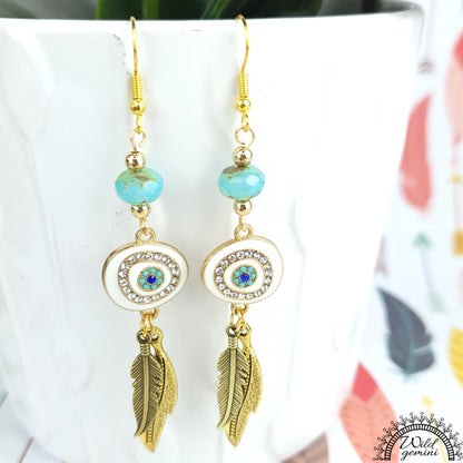 Boho Evil Eye Earrings – Handmade Gold Dangles with Teal Faceted Beads, Rhinestone Charms & Layered Feather Drops, 3.25” Long